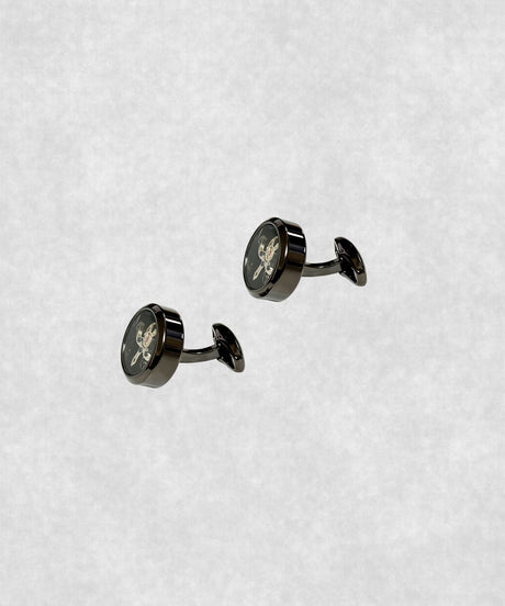 Side view of black-coated tourbillon cufflinks – luxury watch-inspired design with moving flywheel and blue screw details