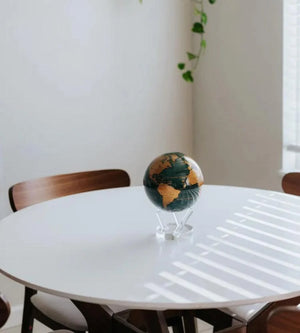 MOVA Emerald Gold Political Map Globe displayed on an table – self-rotating green and gold decorative globe