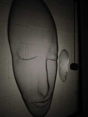 Arturo Álvarez illuminated mesh mask wall sculpture – handcrafted metallic mesh revealing sculptural depth, translucent texture and light