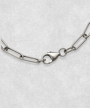 Close-up of 925 sterling silver paperclip bracelet clasp – polished elongated link chain detail