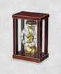 14-day mechanical clock with brown natural wood frame – exposed movement, pendulum and hourly bell chime