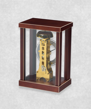 Back view of 14-day mechanical clock with brown natural wood frame – exposed movement, pendulum and hourly bell chime